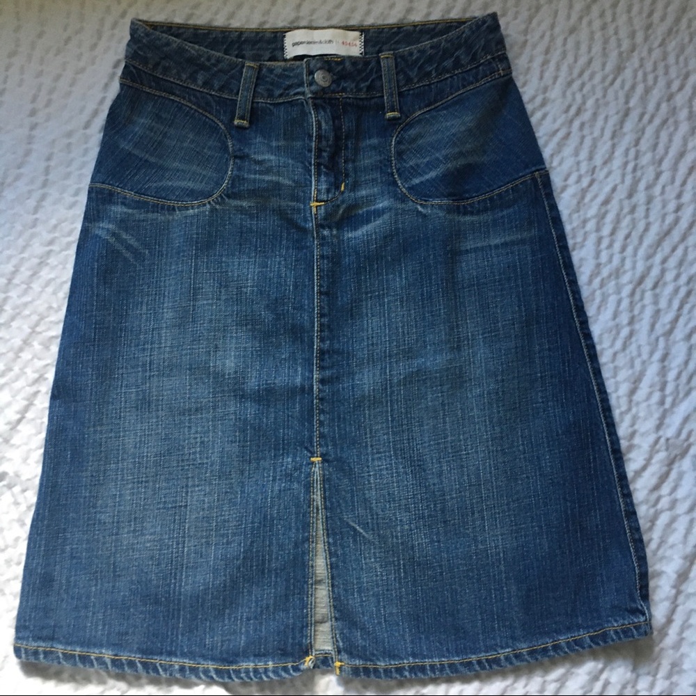 Denim skirt just above the knee with slit. Size 2